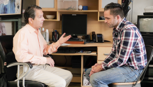 An employee meeting with his direct superior to discuss the sexual harassment he has been dealing with