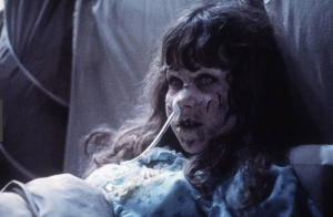 Regan from The Exorcist in bed, Halloween Monsters and Ghoulish Safety
